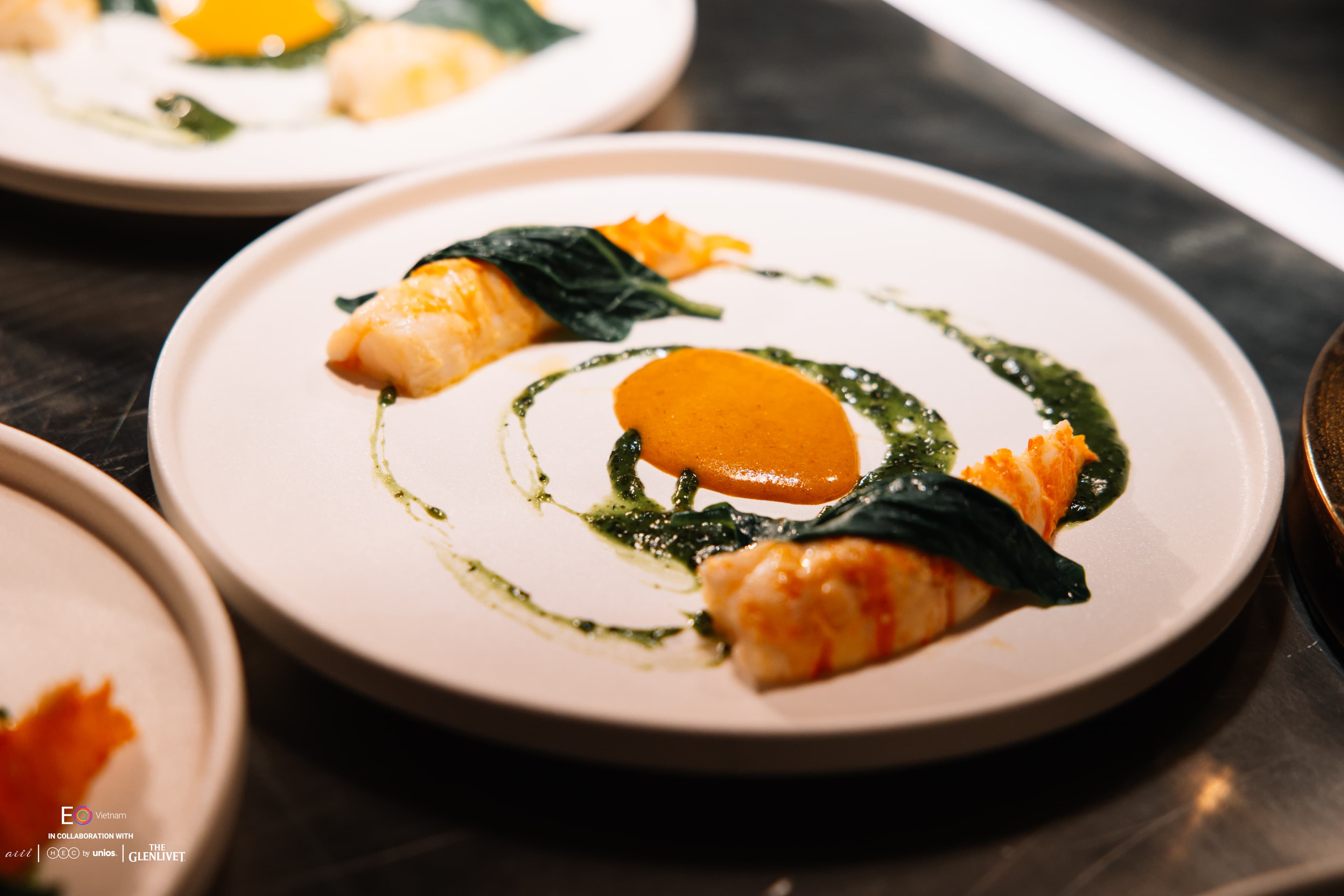 A plated course by culinary partner aiii House Saigon at the EO Vietnam Handover Party
