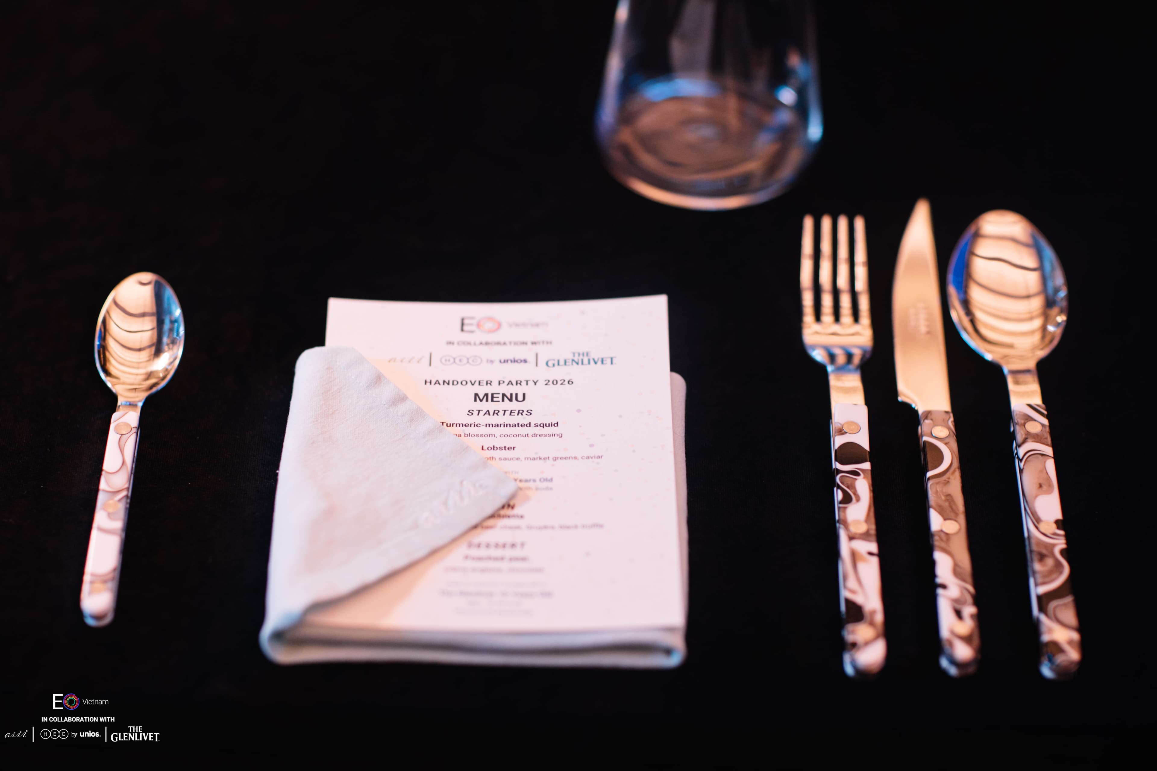 Table setting and menu by aiii House Saigon at the EO Vietnam Handover